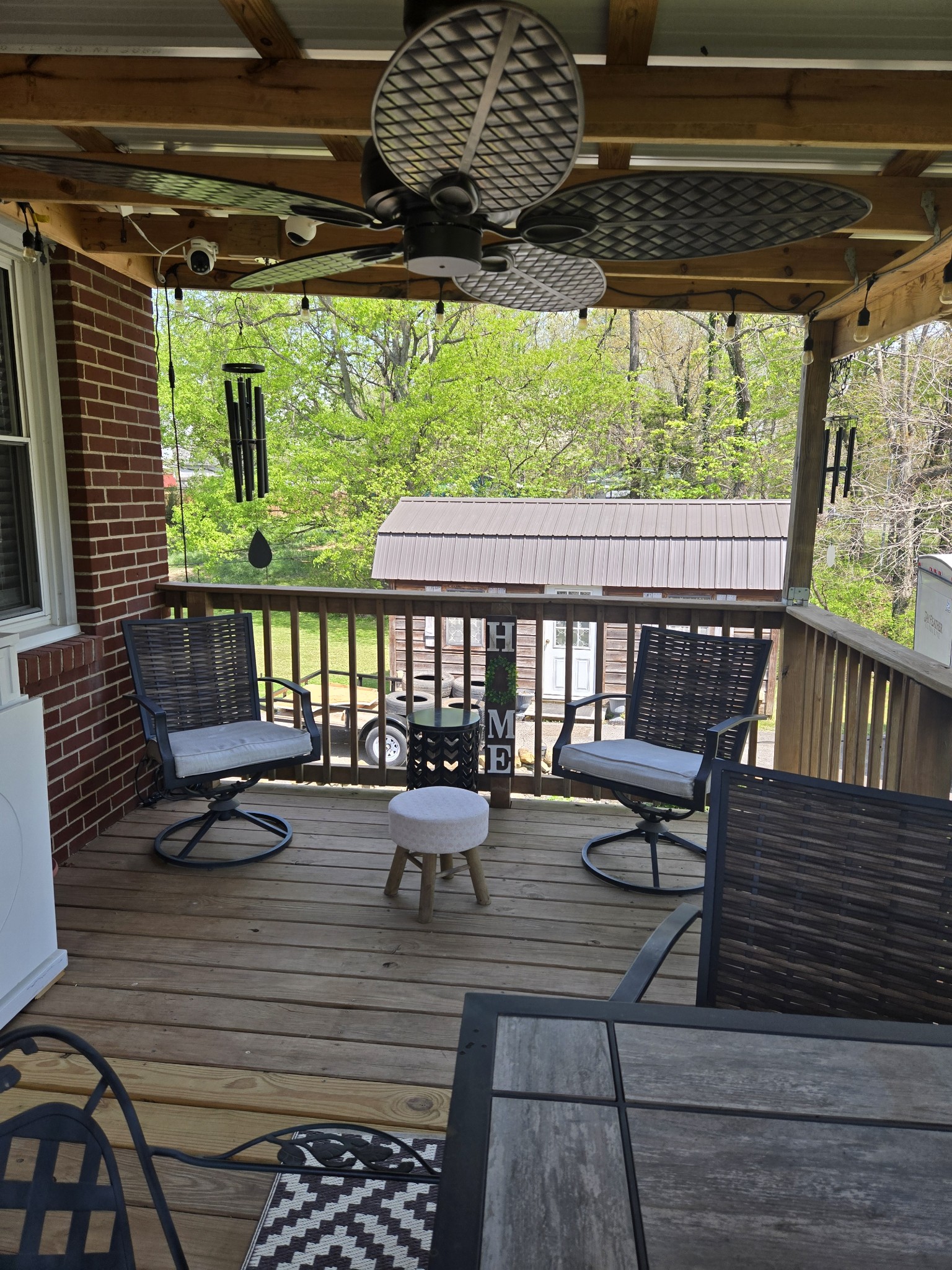 1605 New Dry Hollow Road Vanleer, TN 37181 - Photo 29 of 40 a view of a balcony with chairs and wooden floor