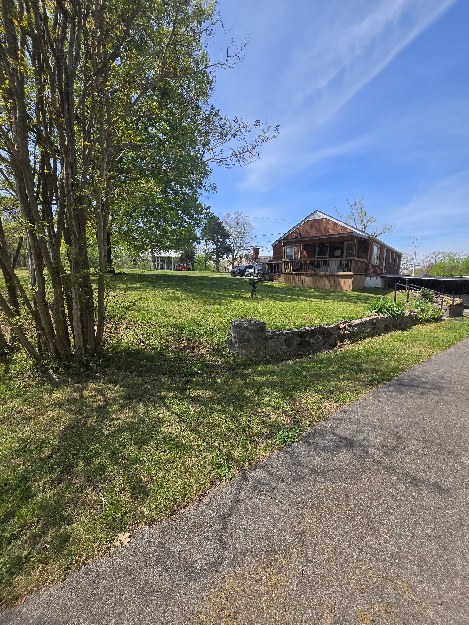 1605 New Dry Hollow Road Vanleer, TN 37181 - Photo 32 of 40 a view of a house with a yard and a large tree
