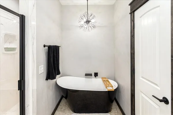 a bedroom with a bed and a couch
