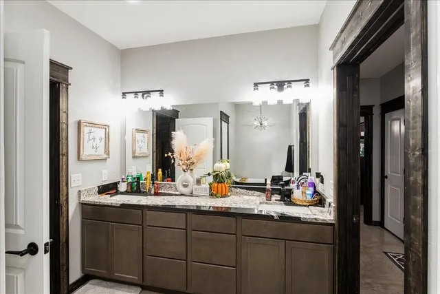 a view of bathroom and mirror