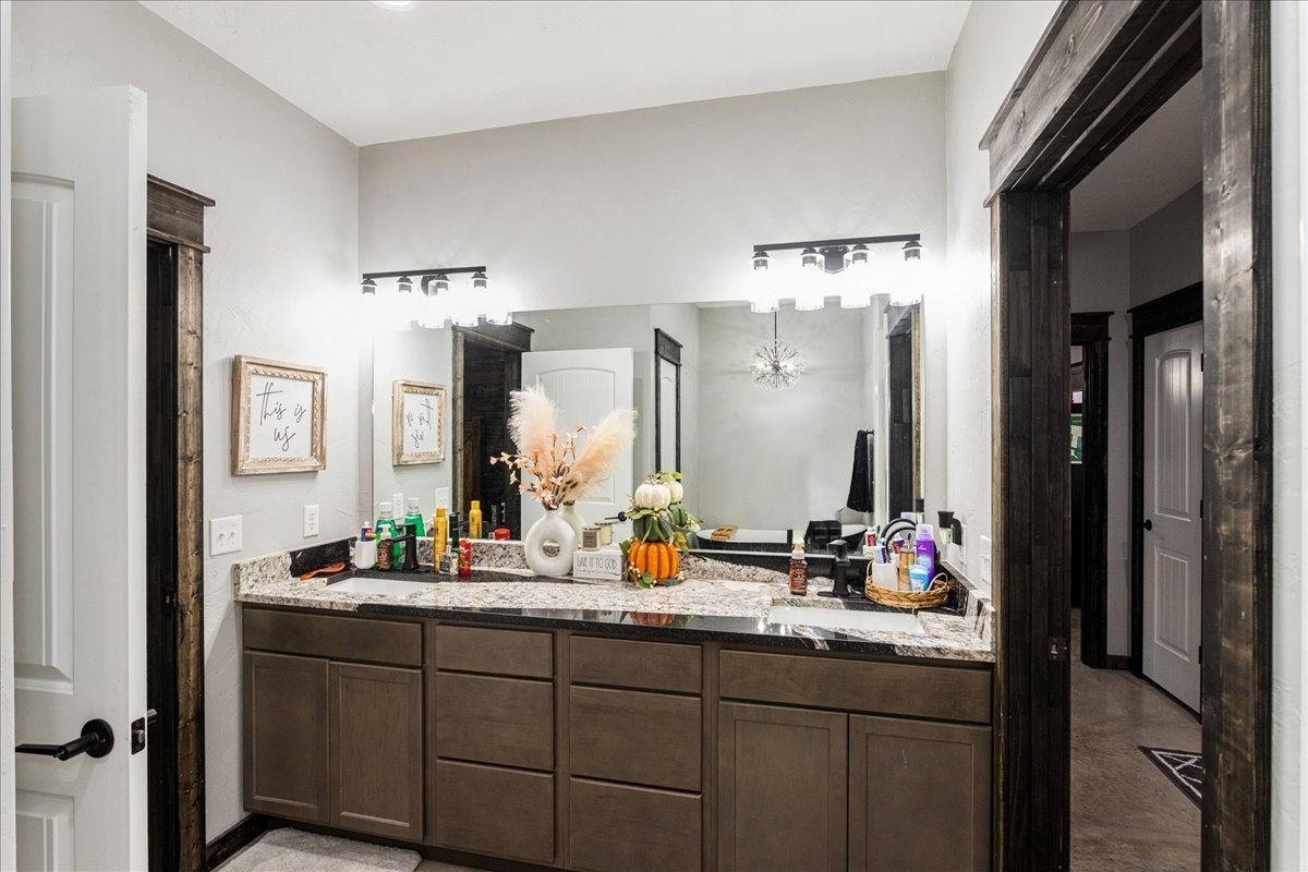 2032 Pahal Road Huntington, TX 75949 - Photo 18 of 45 a bathroom with a granite countertop sink and a mirror