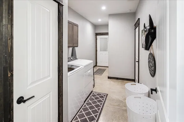 a living room with furniture and a rug