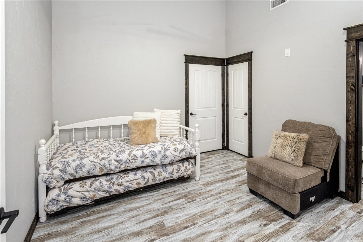 2032 Pahal Road Huntington, TX 75949 - Photo 34 of 45 a bedroom with a bed and a couch