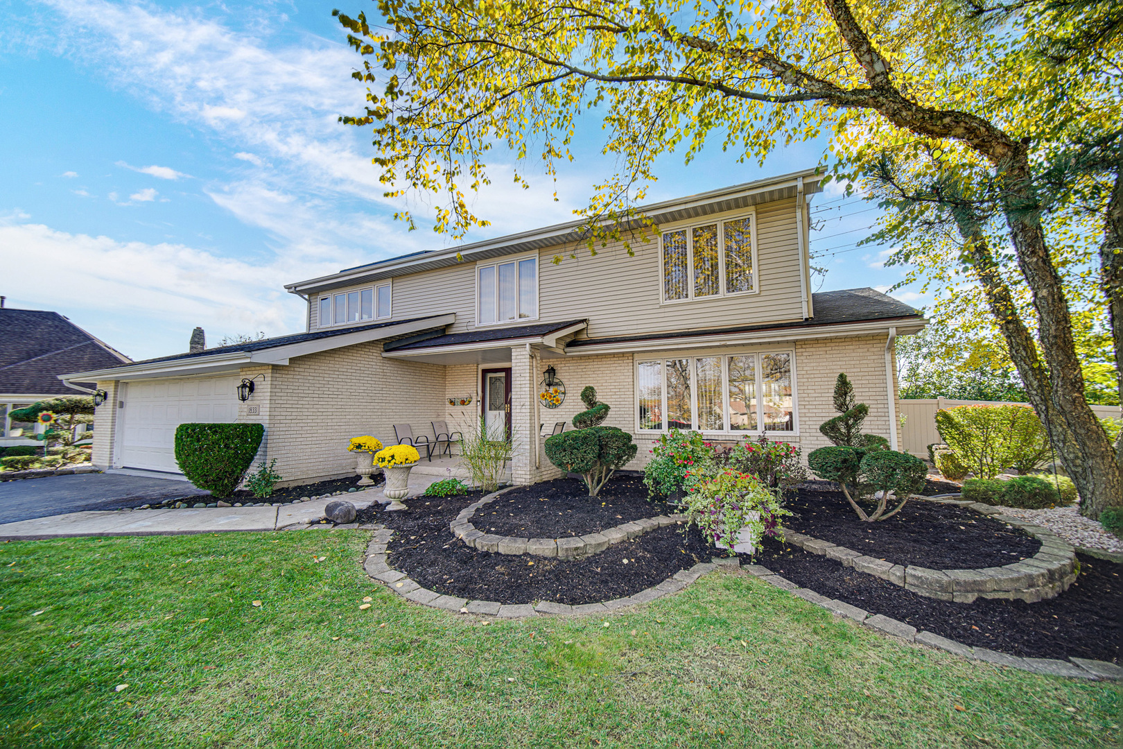 a front view of a house with garden