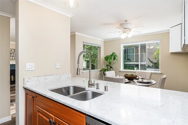a kitchen with a sink and a refrigerator