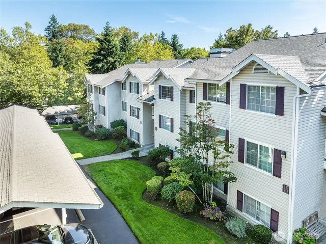 a aerial view of white house with a yard