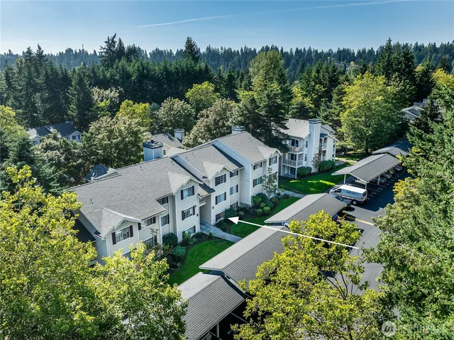 an aerial view of a house with a yard