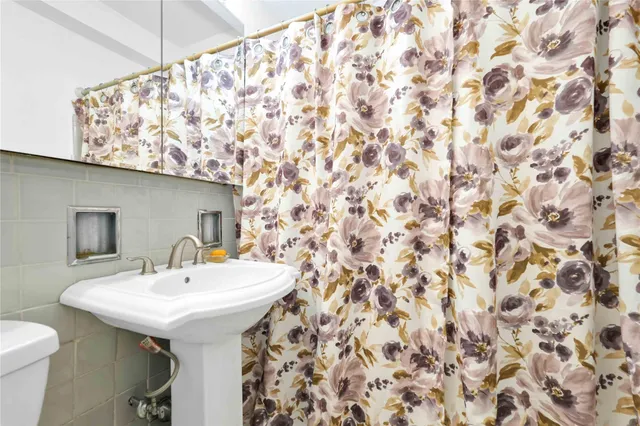 a bathroom with a sink and mirror