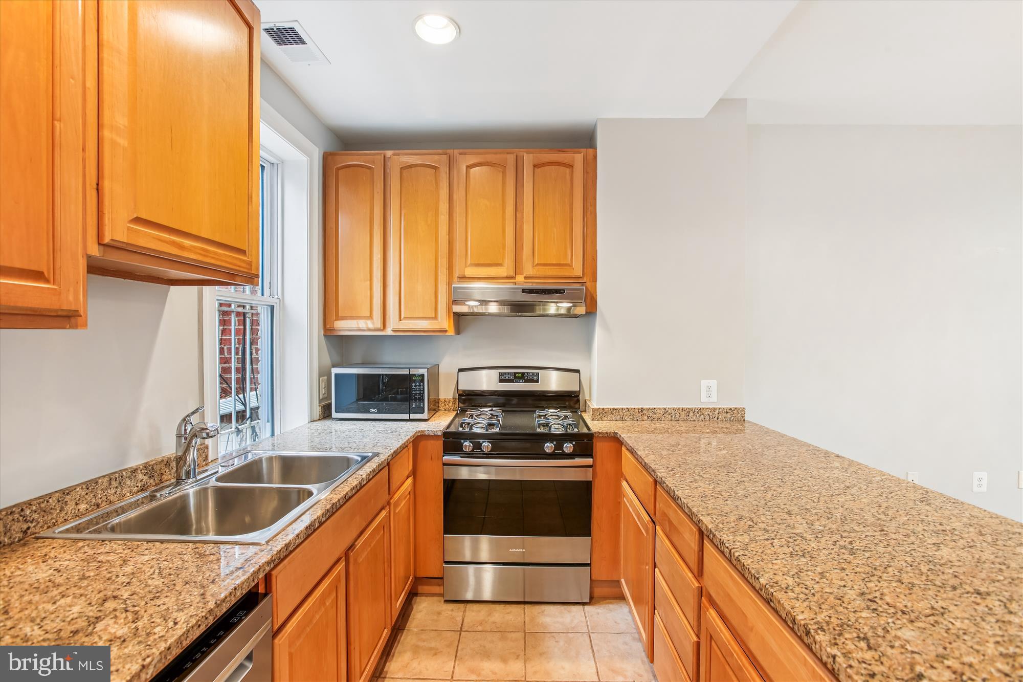1610 4th Street Northwest Washington, DC 20001 - Photo 14 of 47 a kitchen that has a sink and a stove