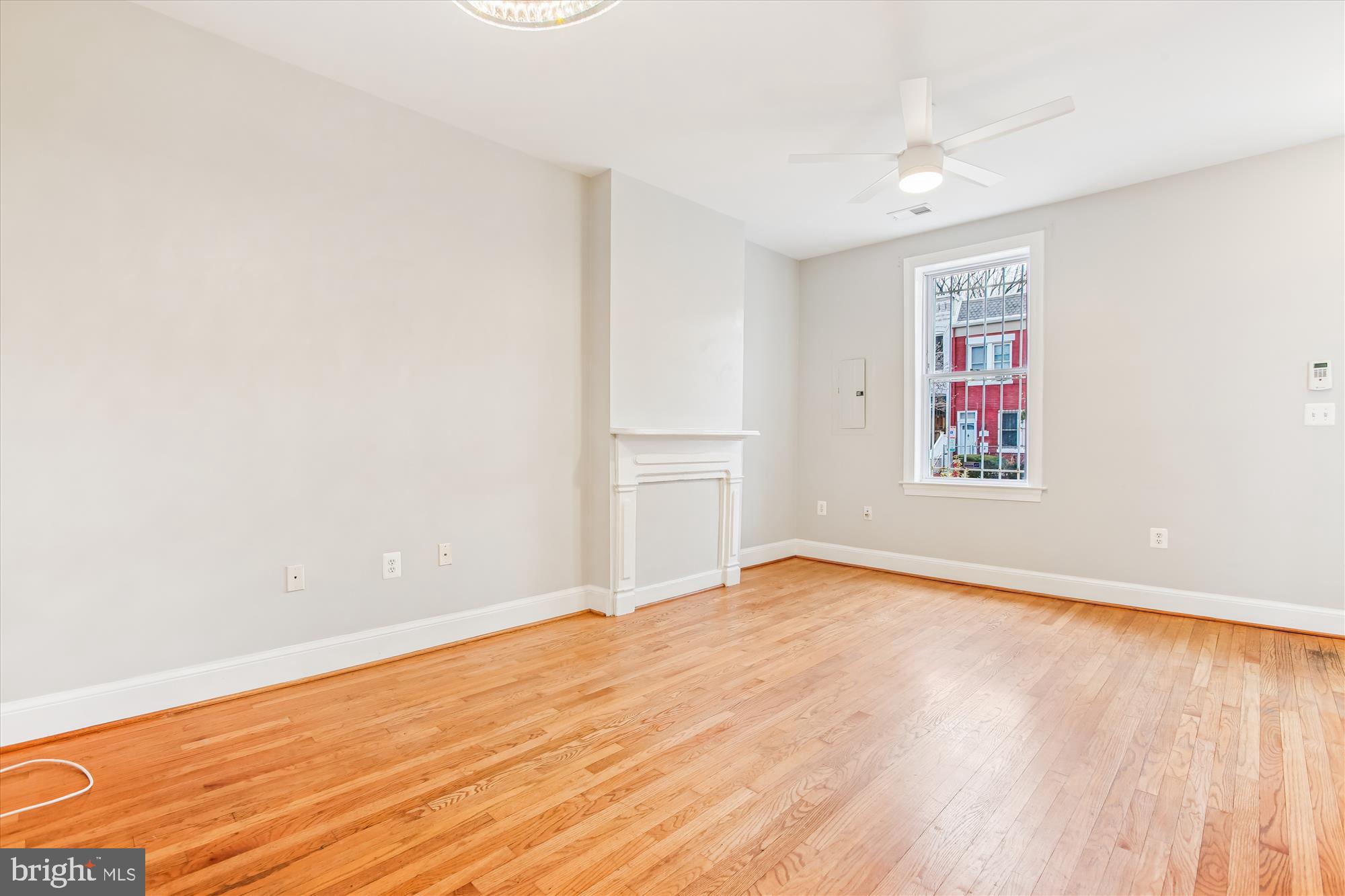 1610 4th Street Northwest Washington, DC 20001 - Photo 7 of 47 an empty room with wooden floor and windows