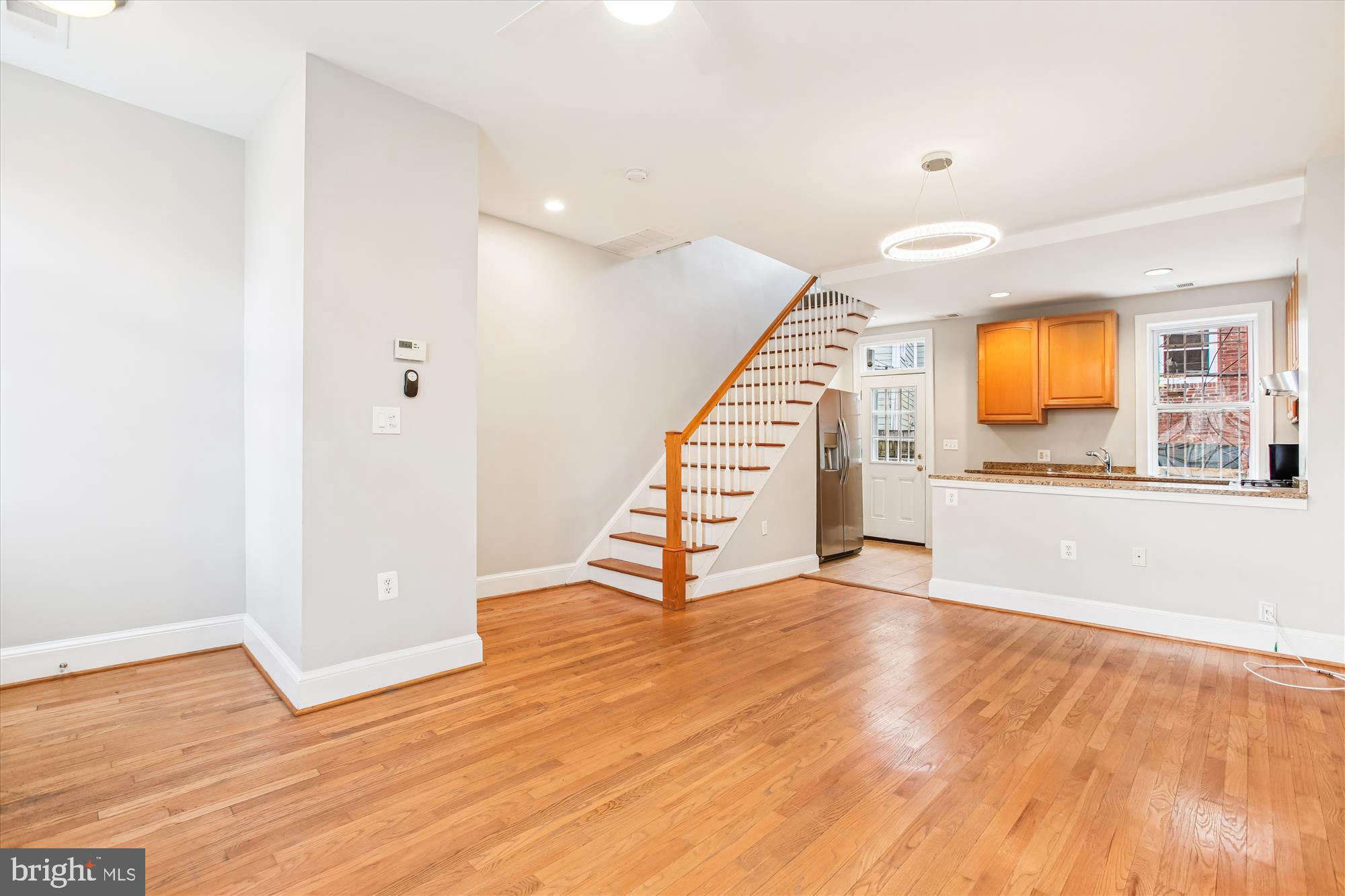 1610 4th Street Northwest Washington, DC 20001 - Photo 9 of 47 a view of a hallway with wooden floor and staircase