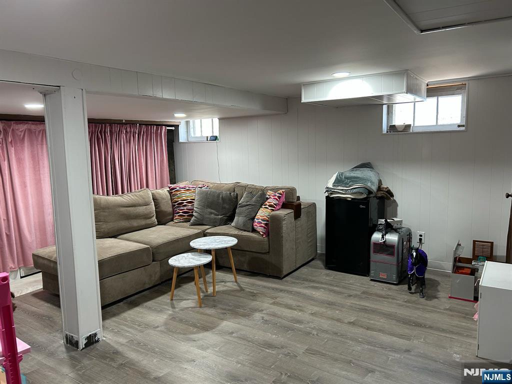 441 New Bridge Road Bergenfield, NJ 07621 - Photo 11 of 11 a living room with furniture and a flat screen tv