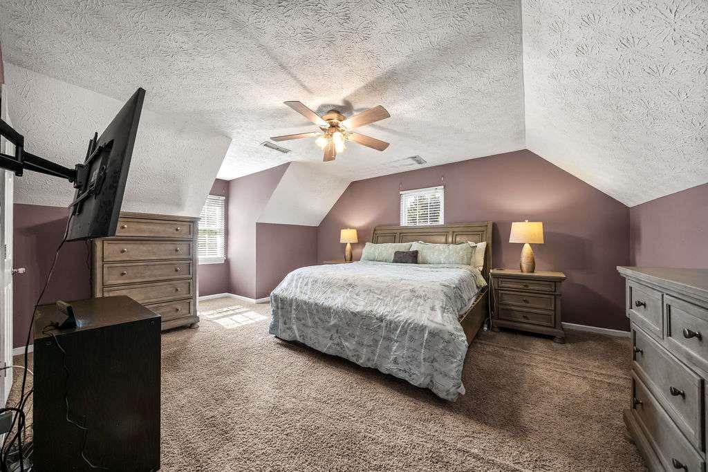 7 College View Drive Southwest Rome, GA 30161 - Photo 26 of 49 a bedroom with a bed and dresser with mirror