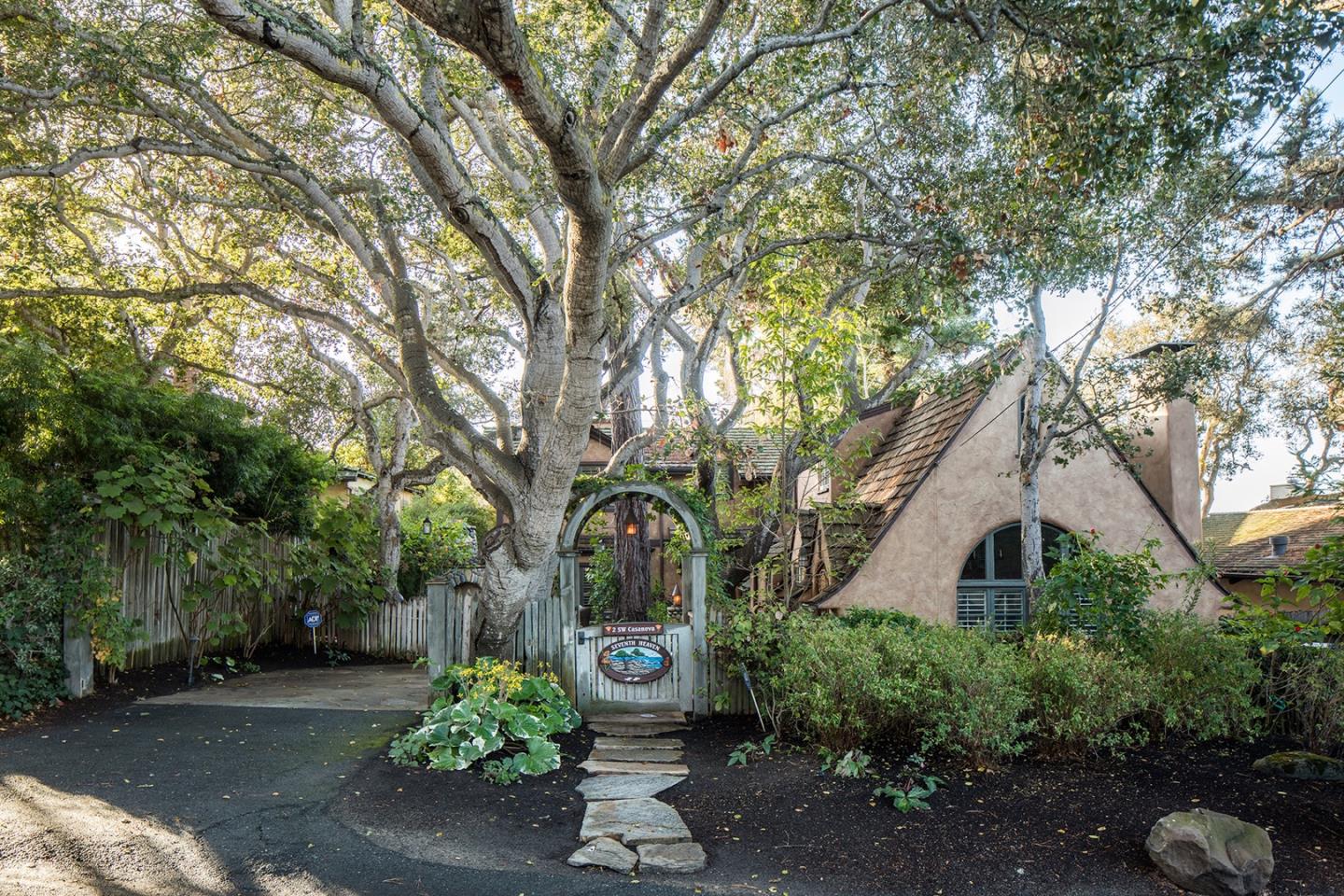 a front view of a house with garden