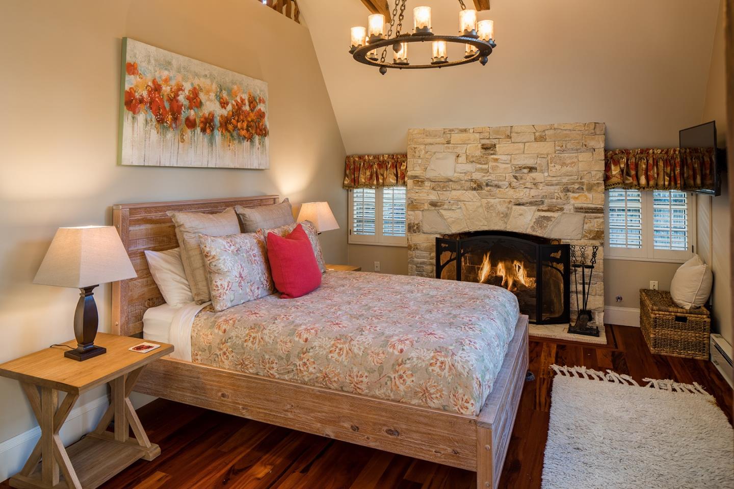 0 Seventh Ave 2 Carmel, CA 93923 - Photo 17 of 23 a bedroom with a bed and a fireplace