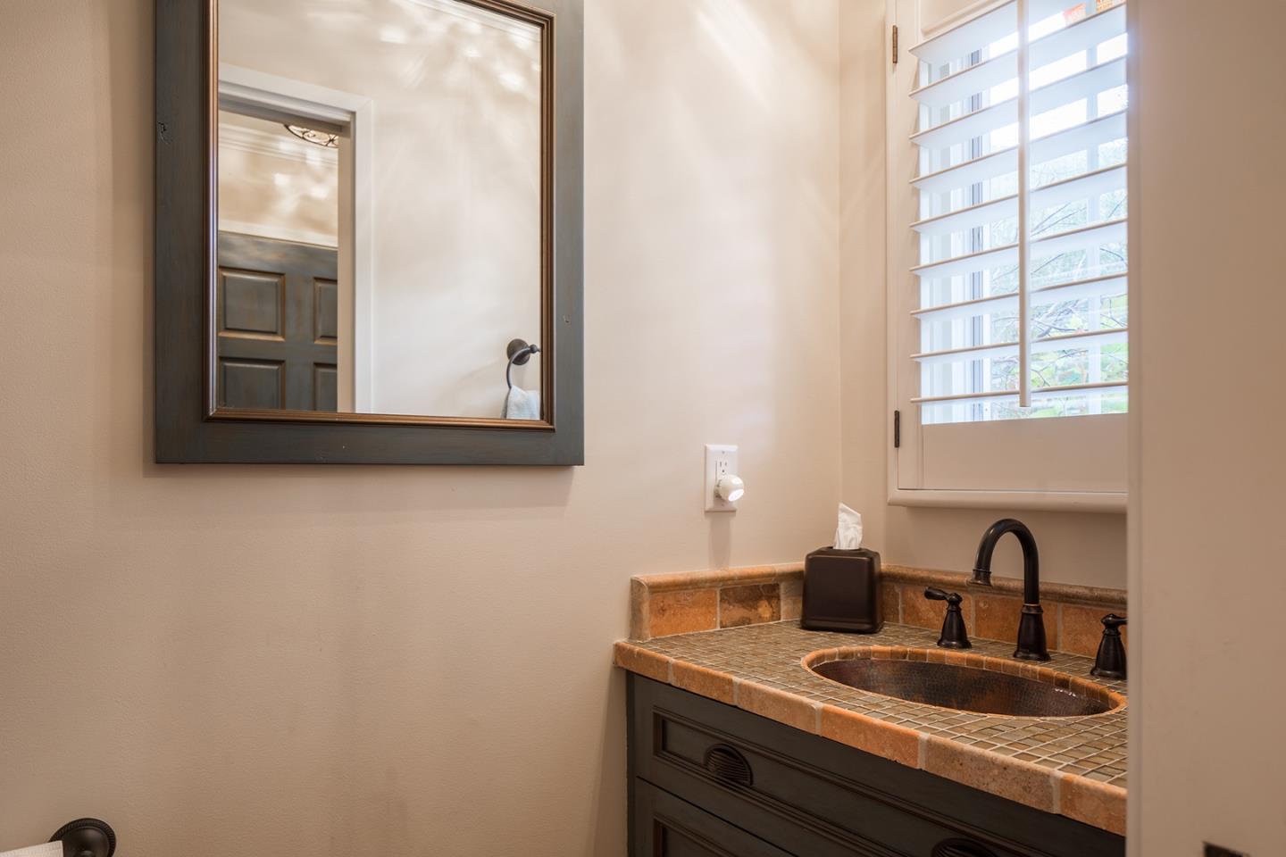 0 Seventh Ave 2 Carmel, CA 93923 - Photo 21 of 23 a bathroom with a sink and a mirror