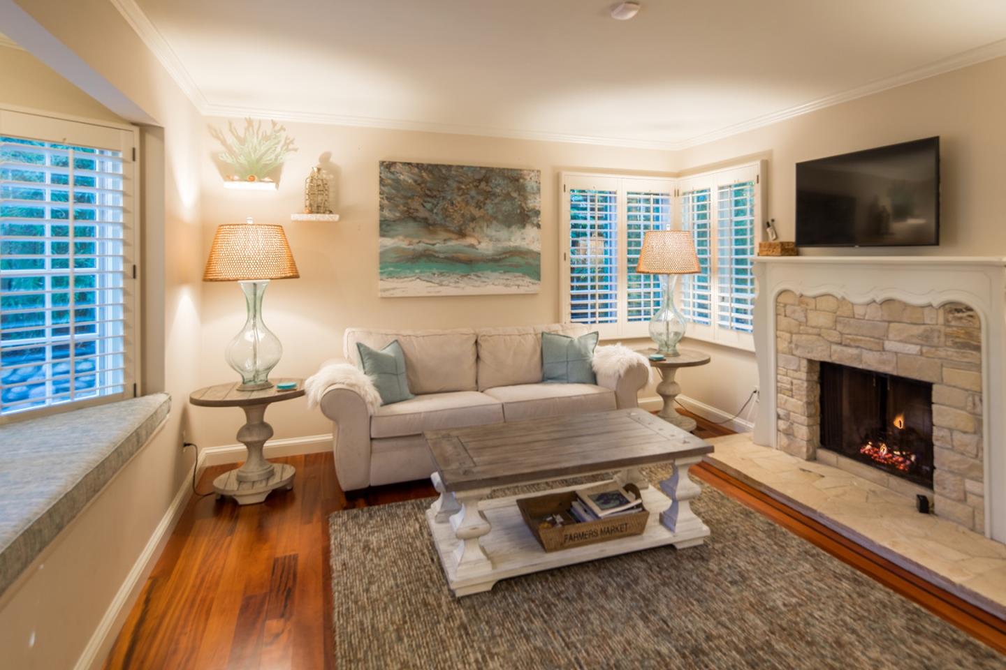 0 Seventh Ave 2 Carmel, CA 93923 - Photo 8 of 23 a living room with furniture flat screen tv and a fireplace