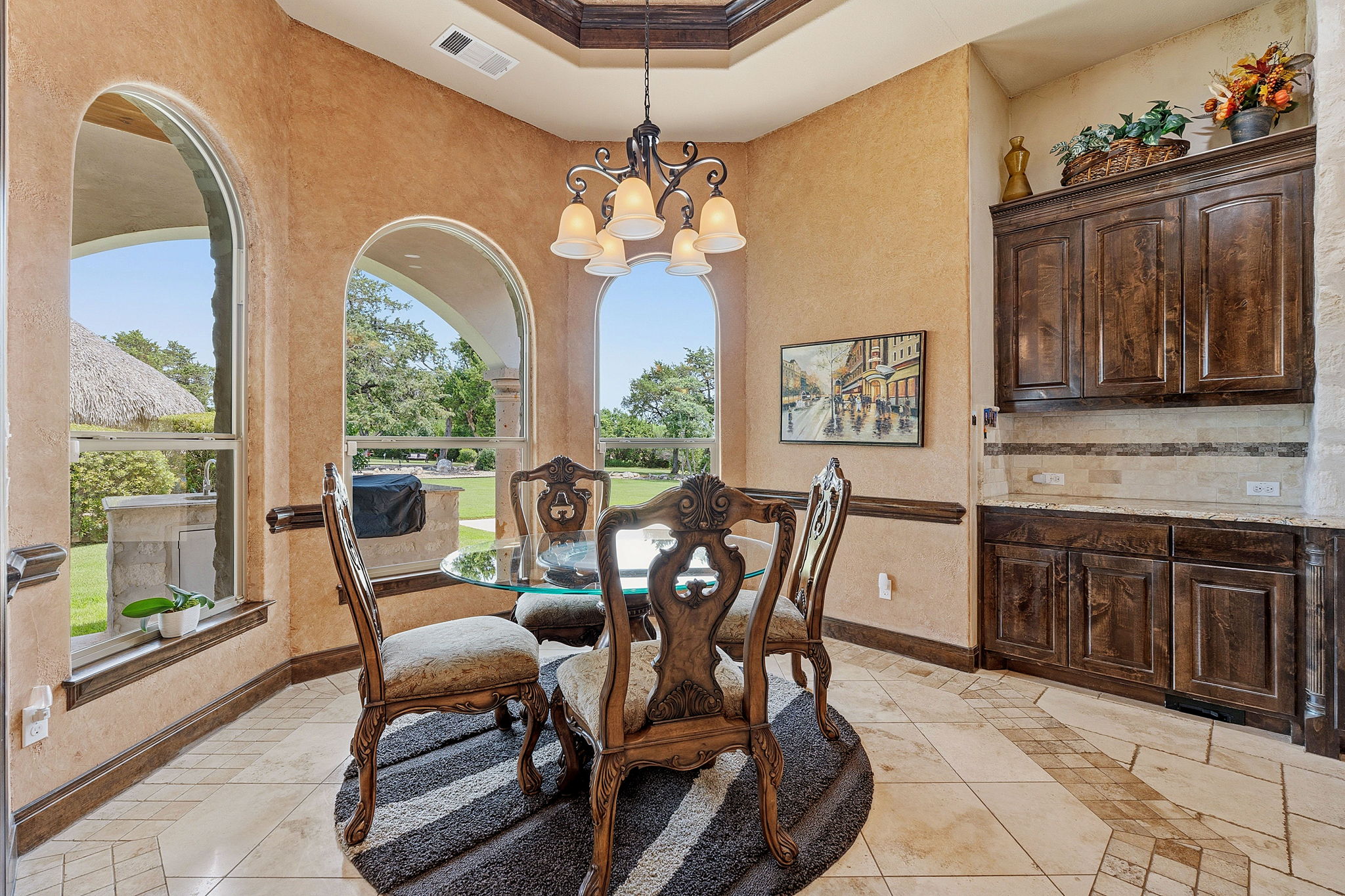 816 Brave Face Street Leander, TX 78641 - Photo 11 of 40 Arched windows illuminate this dining space, creating an ideal setting for meals and entertaining.