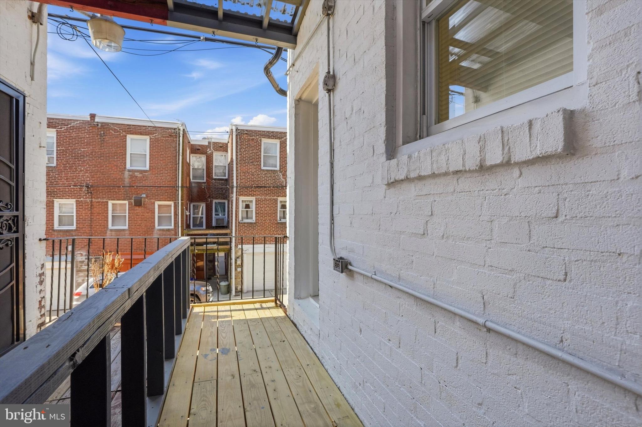 6258 Magnolia Street Philadelphia, PA 19144 - Photo 14 of 25 a view of a balcony with wooden floor and stairs
