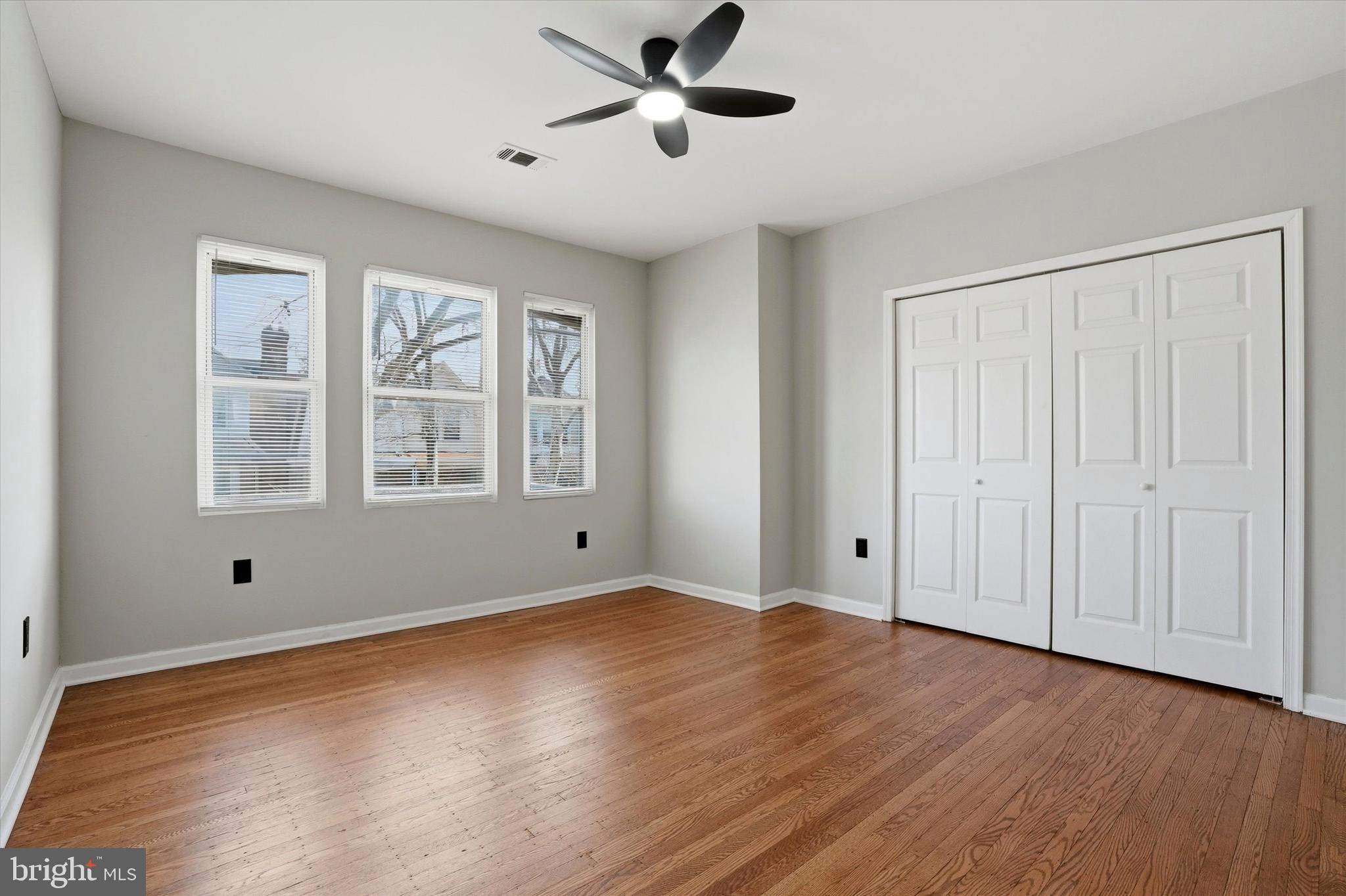 6258 Magnolia Street Philadelphia, PA 19144 - Photo 16 of 25 a view of an empty room with wooden floor and a window