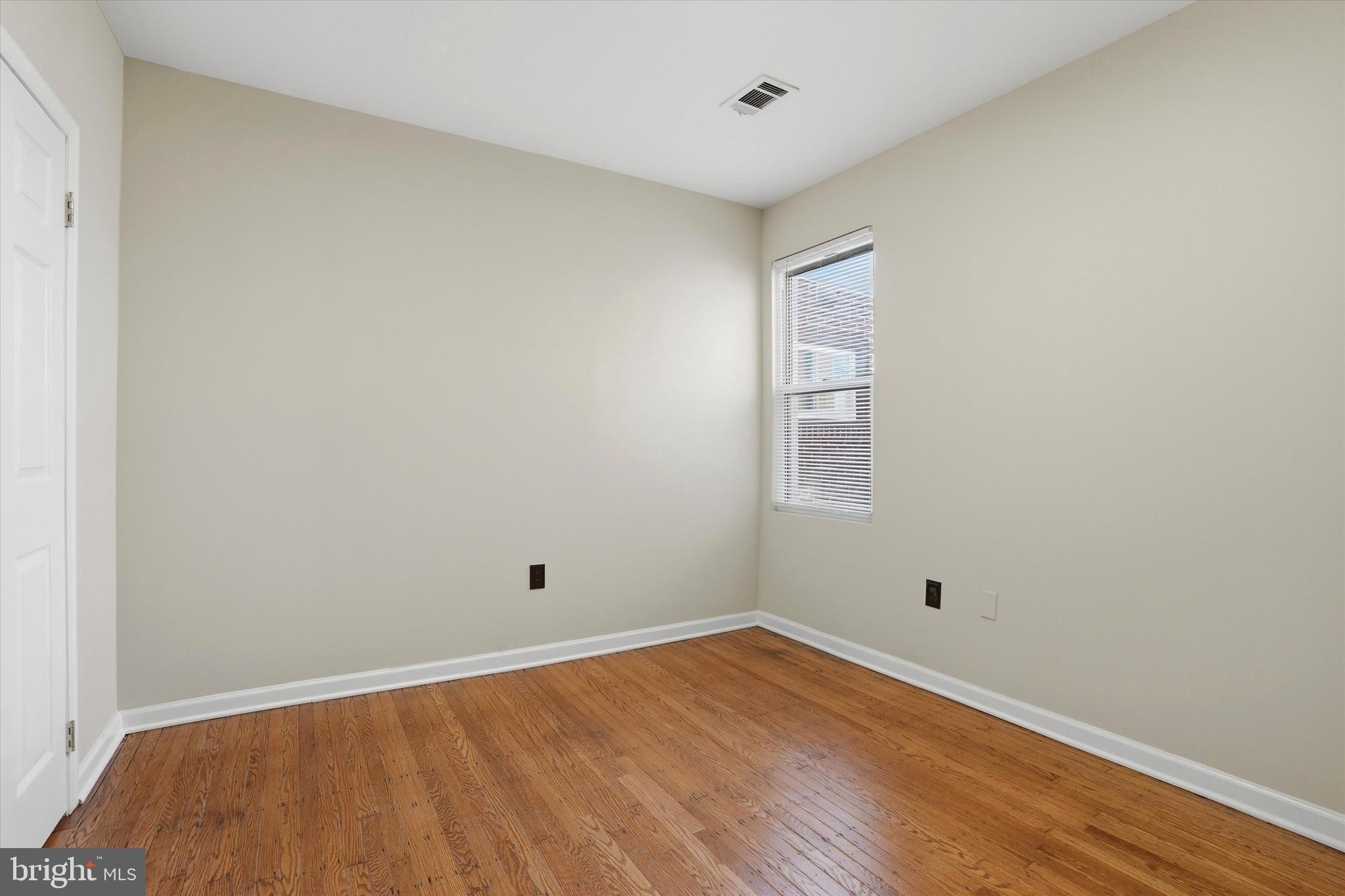 6258 Magnolia Street Philadelphia, PA 19144 - Photo 18 of 25 a view of an empty room with wooden floor
