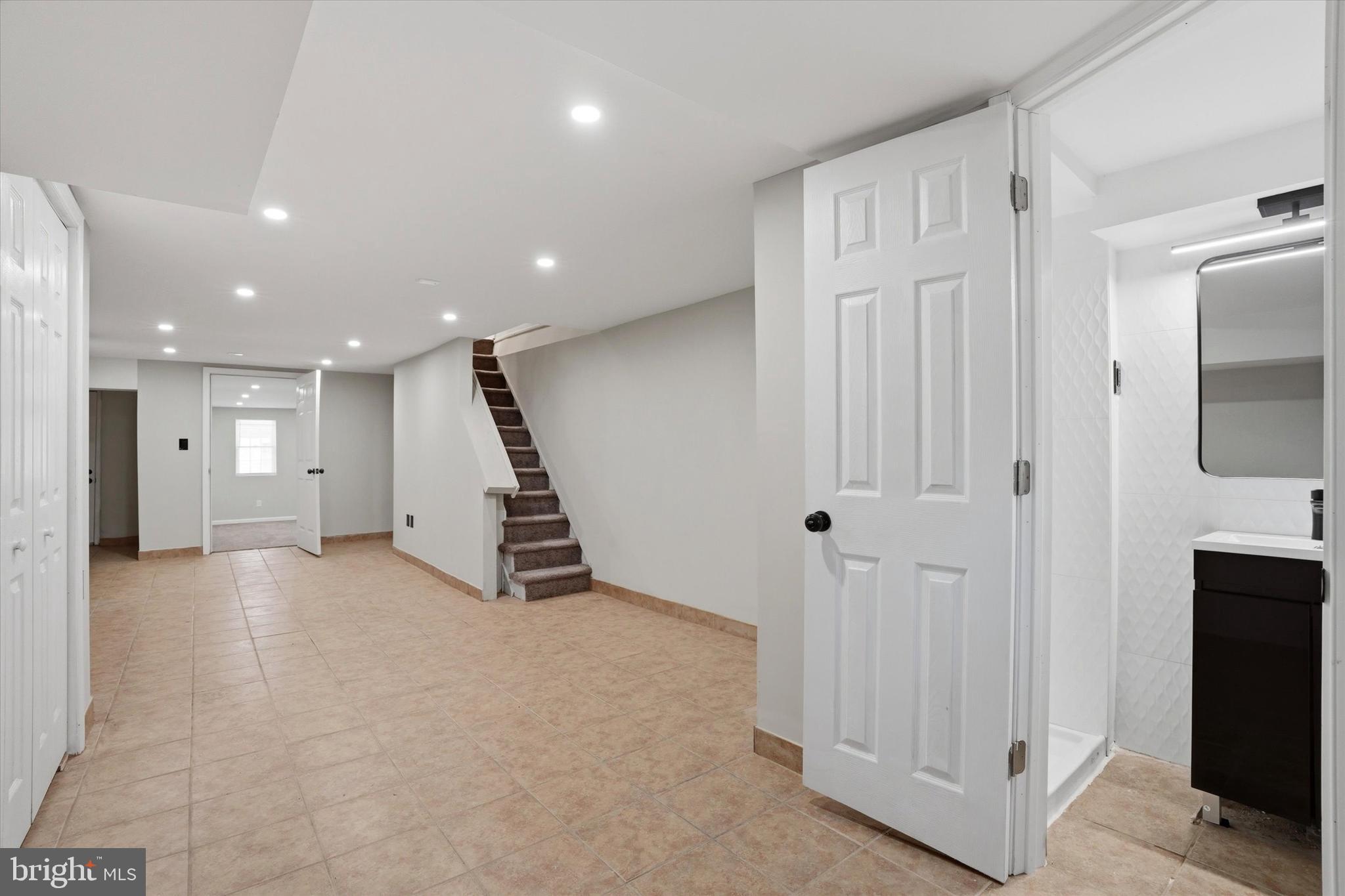 6258 Magnolia Street Philadelphia, PA 19144 - Photo 21 of 25 a view of an empty room with wooden floor and windows