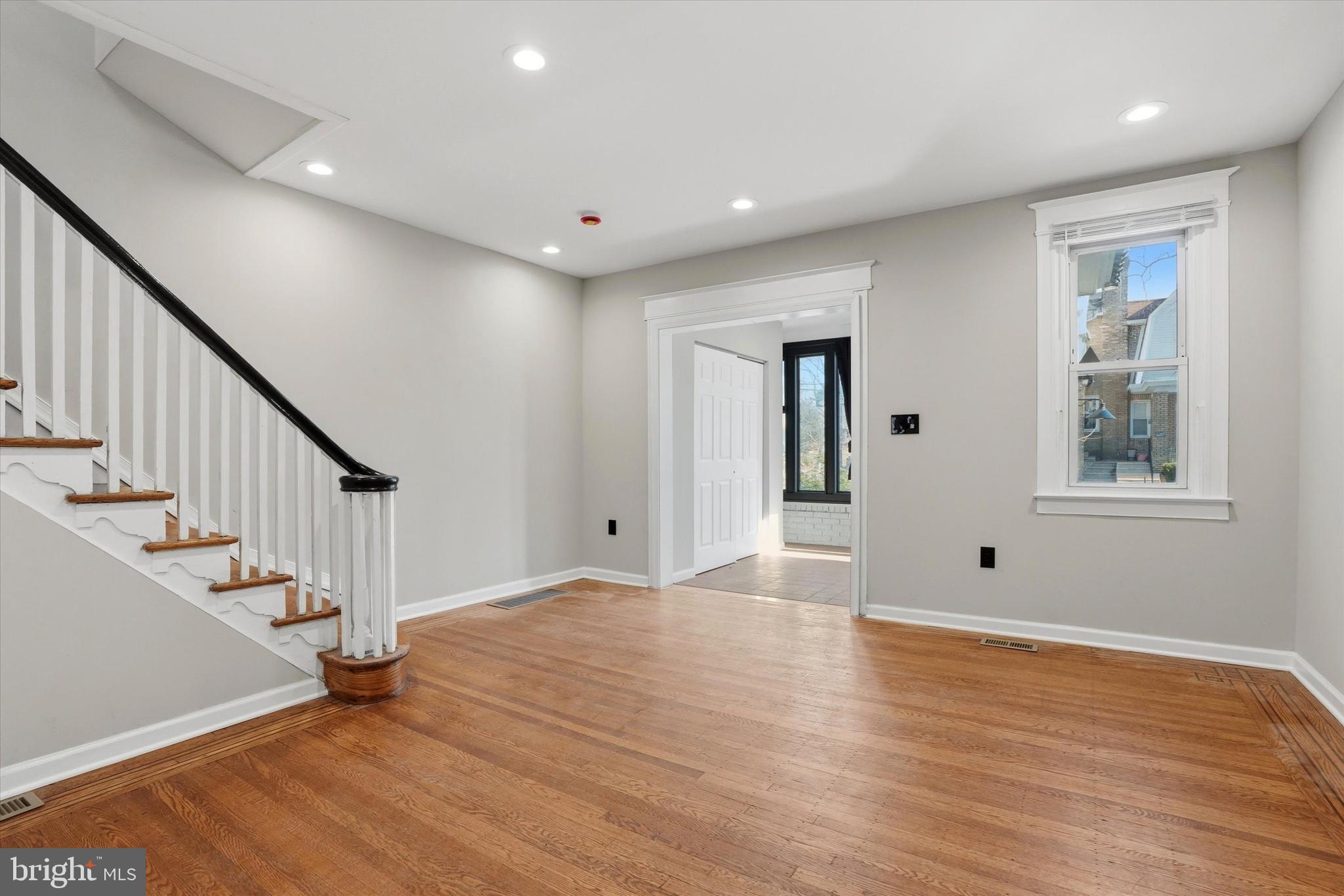 6258 Magnolia Street Philadelphia, PA 19144 - Photo 6 of 25 a view of empty room with wooden floor and fan