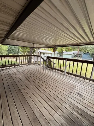 a balcony with wooden floor