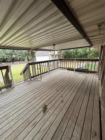a view of balcony with wooden floor