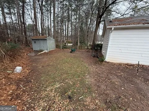 a view of a house with a tree