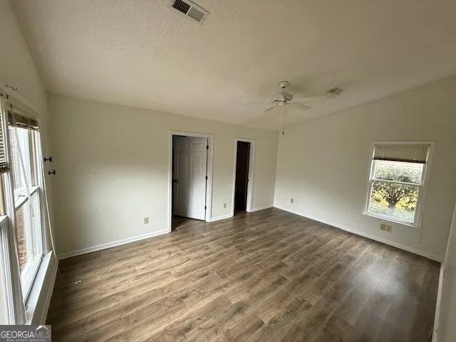 a room with gym equipment and windows