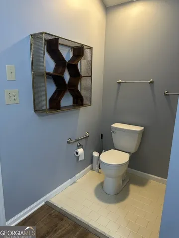 a bathroom with a toilet and a sink