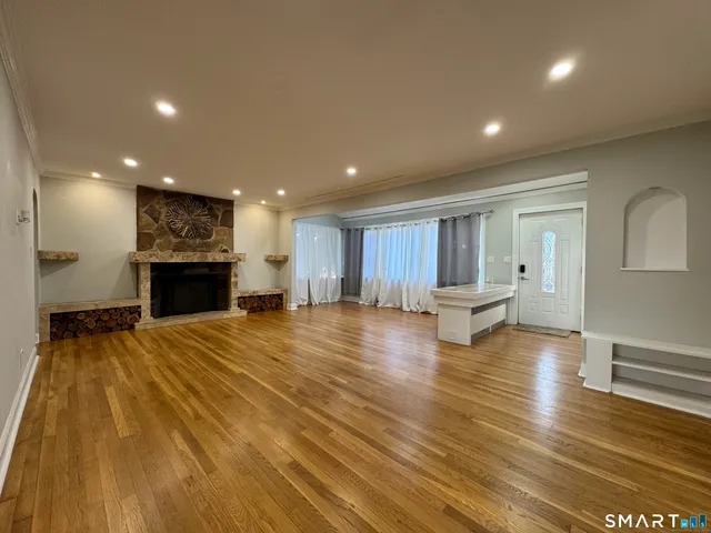a view of kitchen with furniture and wooden floor