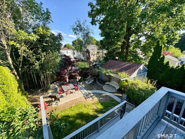 a view of a chairs and table in the balcony