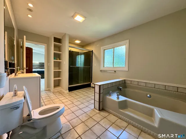 a bathroom with a bathtub sink and toilet