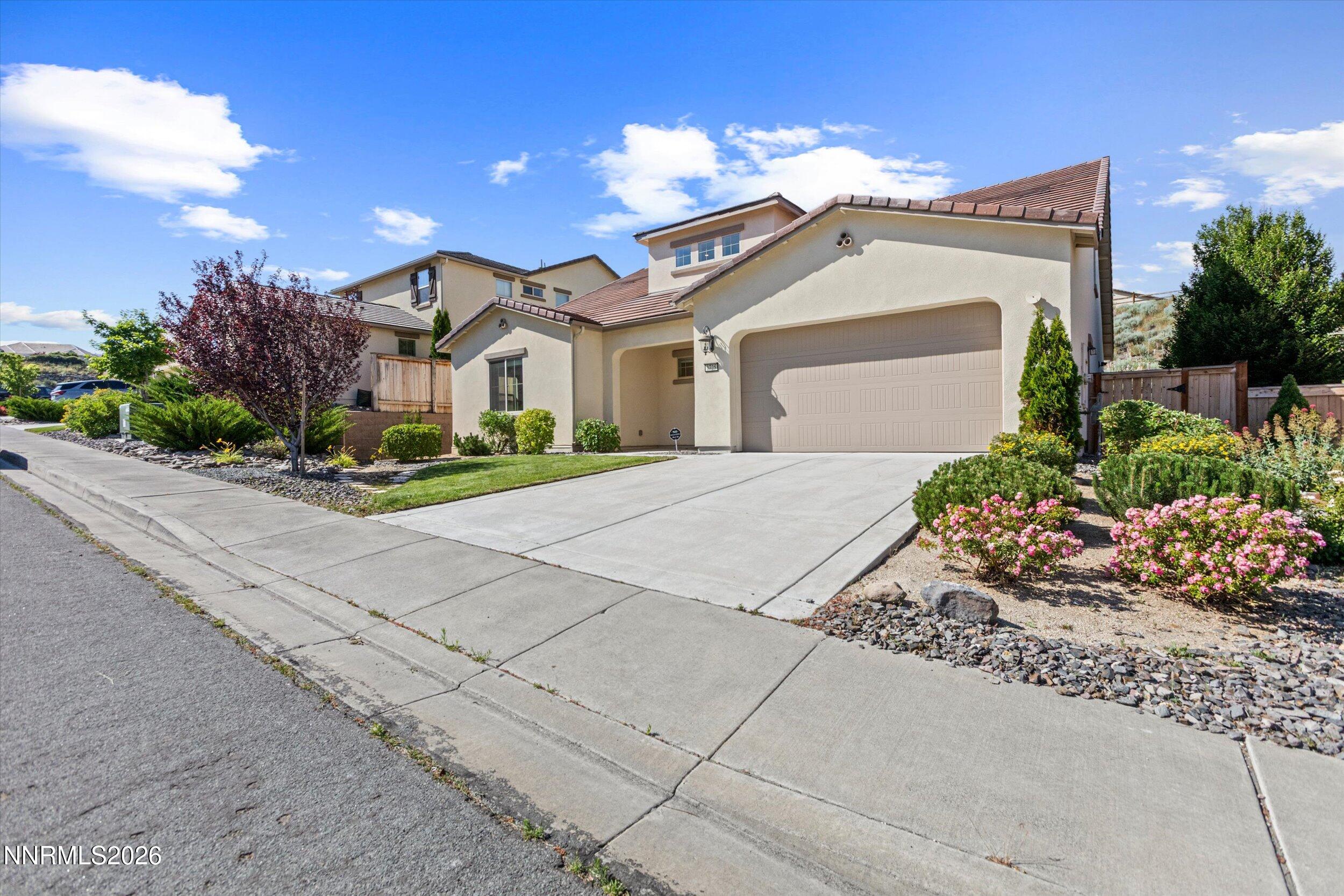 1725 Verdi Vista Court Reno, NV 89523 - Photo 3 of 37 a front view of a house with a garden
