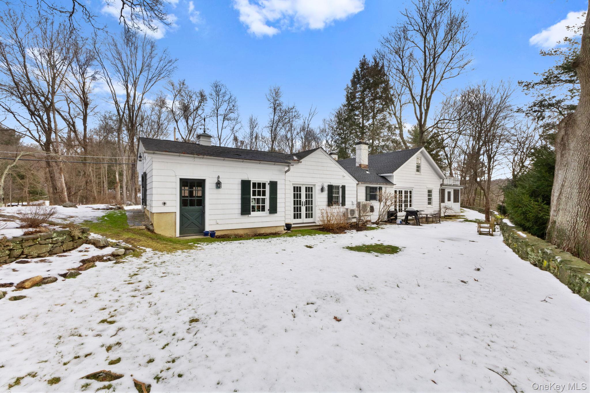 8 South Bedford Road Pound Ridge, NY 10576 - Photo 30 of 32 a view of a house with snow on the ground