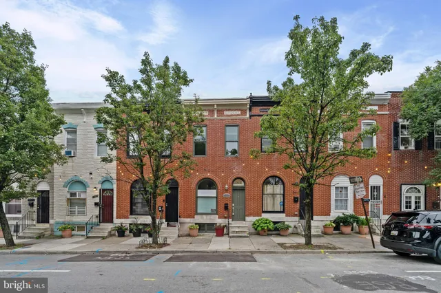 a front view of a building with street view