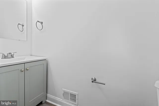 a bathroom with a shower and vanity