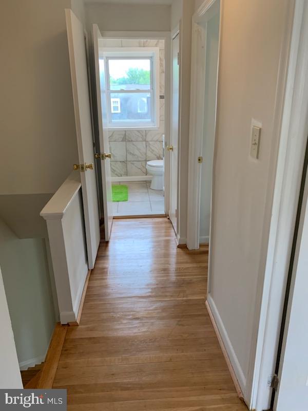 626 Gibson Road Baltimore, MD 21229 - Photo 14 of 35 Upstairs hallway - Hardwood Floors