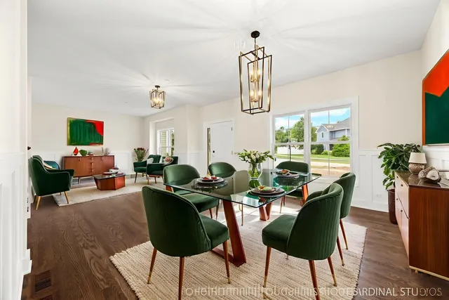 a living room with furniture a chandelier and a flat screen tv