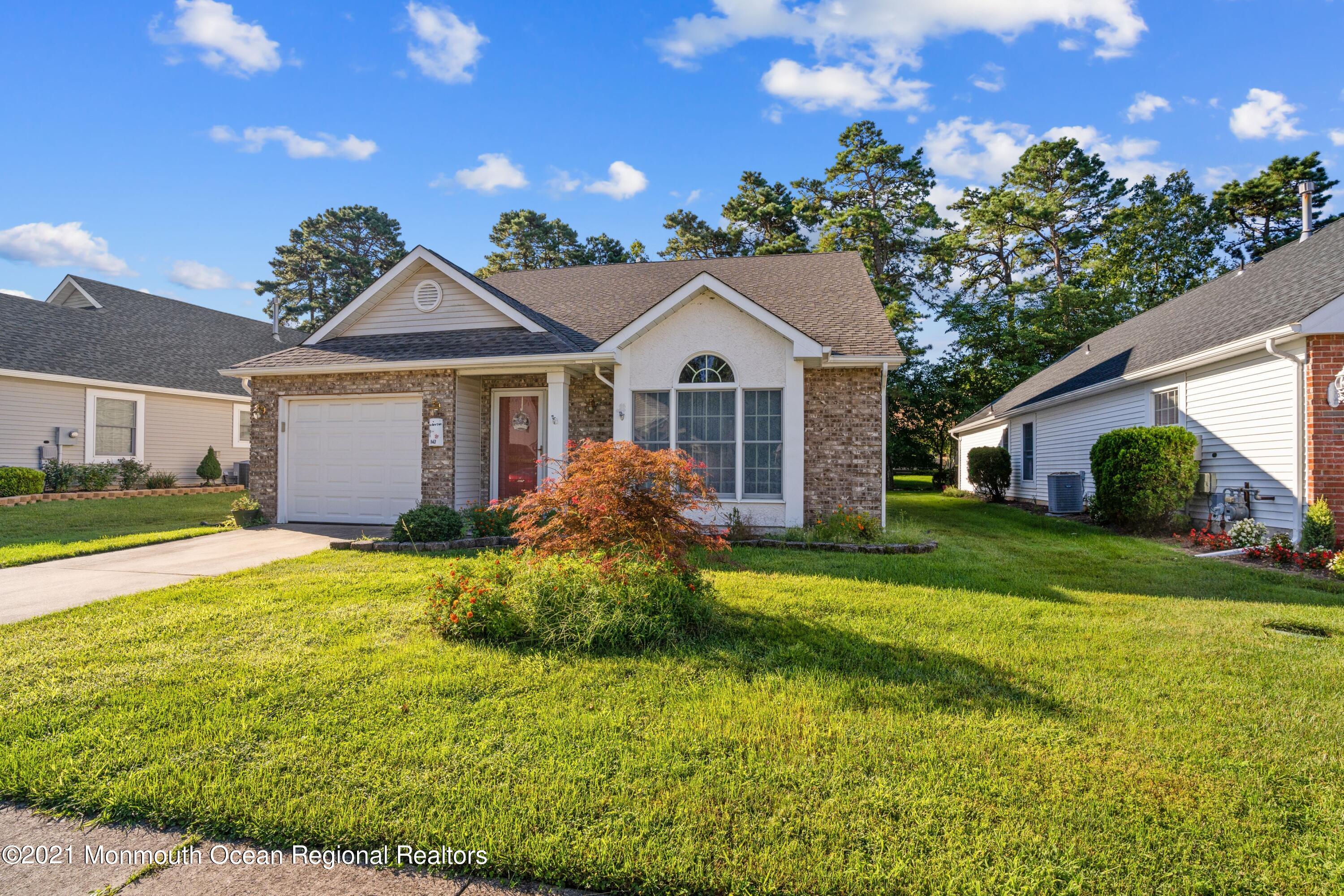 1617 Sweetbay Drive Toms River, NJ 08755 - Photo 2 of 18 a front view of a house with a garden