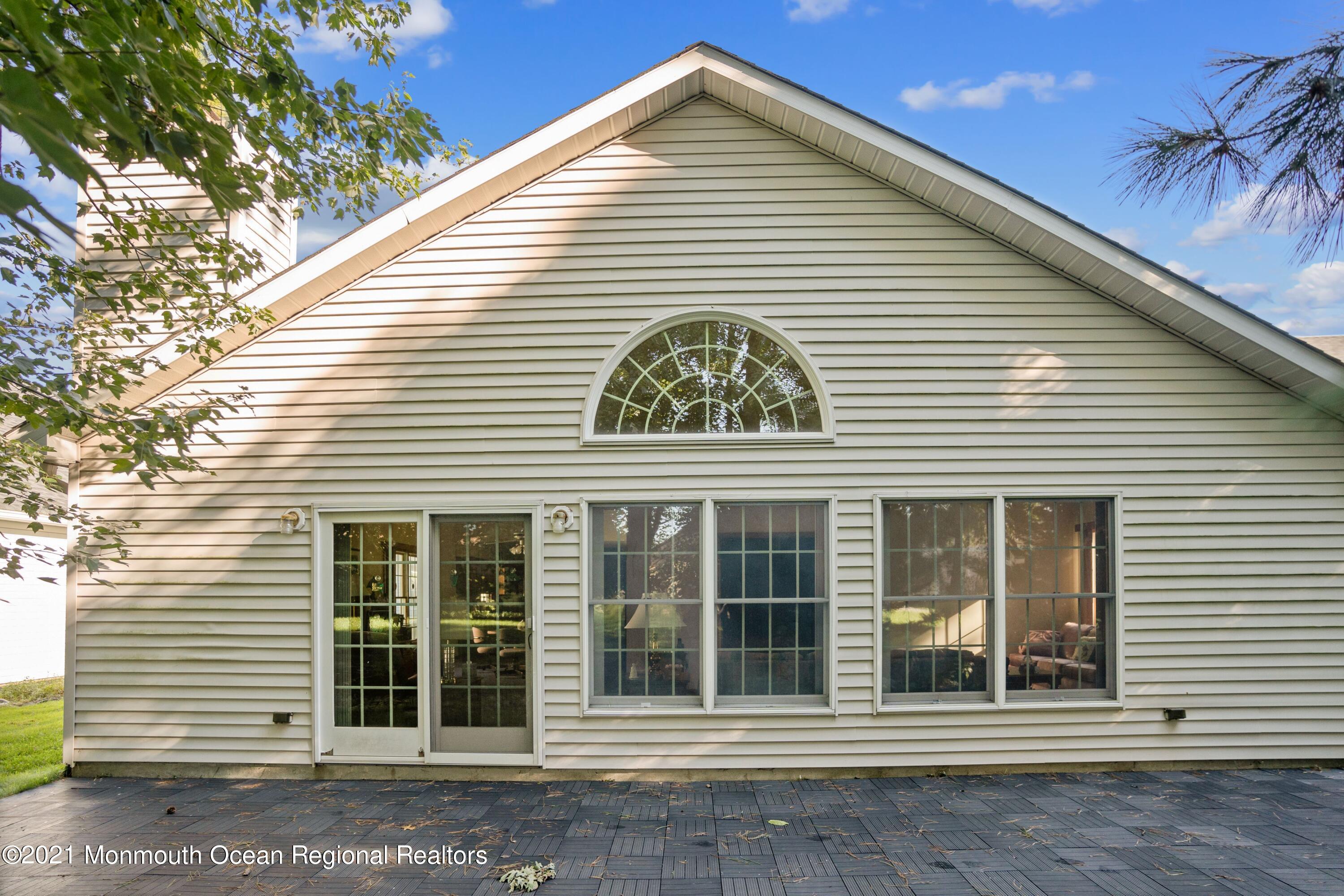 1617 Sweetbay Drive Toms River, NJ 08755 - Photo 17 of 18 a view of a house with a window and brick walls