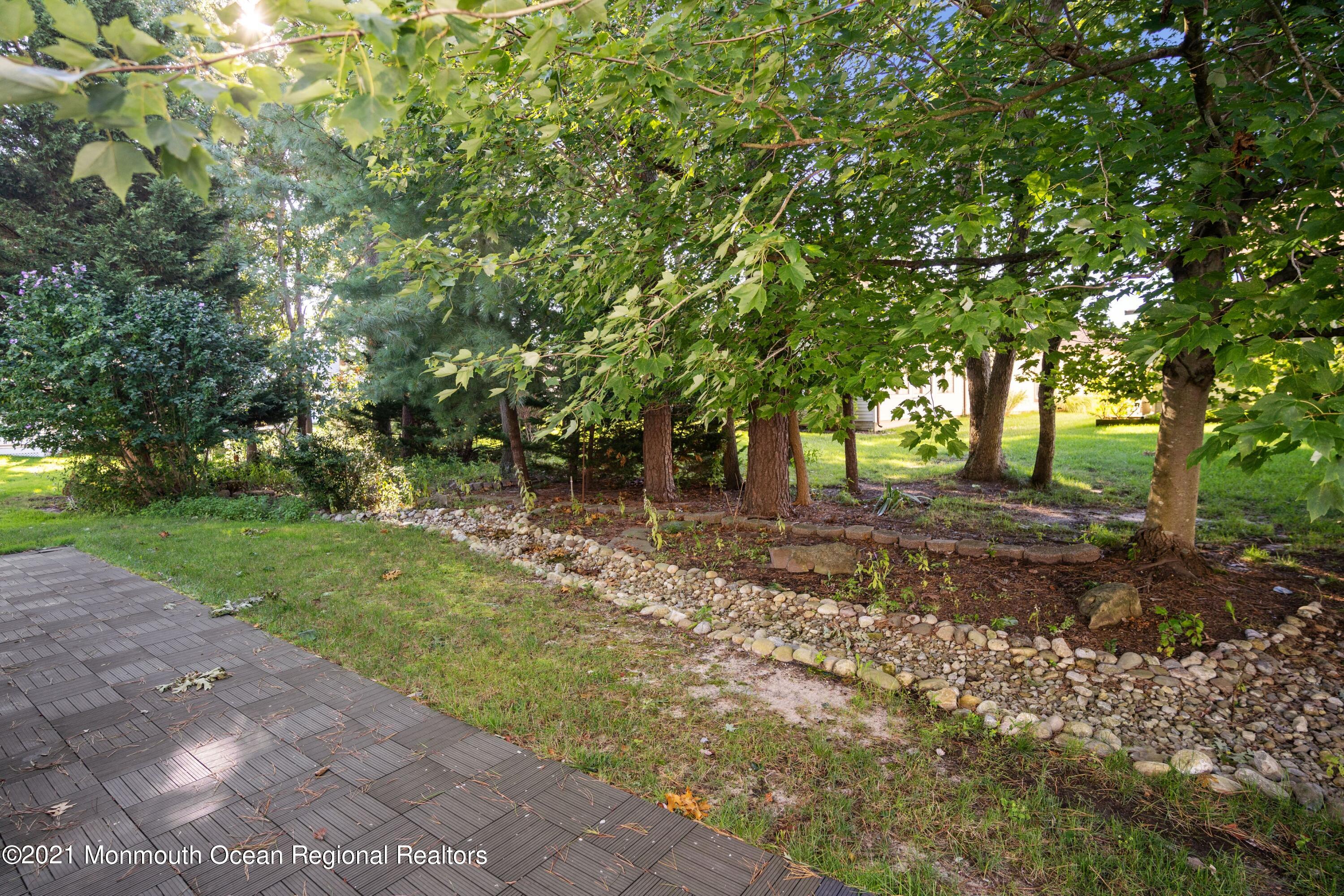1617 Sweetbay Drive Toms River, NJ 08755 - Photo 18 of 18 a backyard of a house with lots of green space