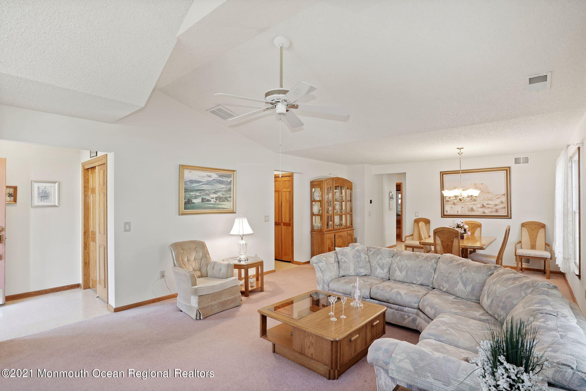 1617 Sweetbay Drive Toms River, NJ 08755 - Photo 3 of 18 a living room with furniture ceiling fan and a rug