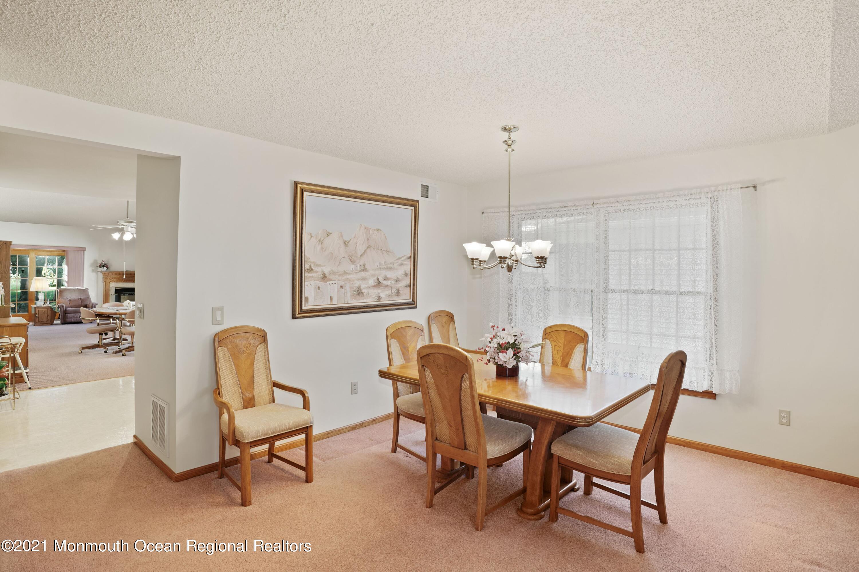 1617 Sweetbay Drive Toms River, NJ 08755 - Photo 5 of 18 a dining room with furniture and chandelier