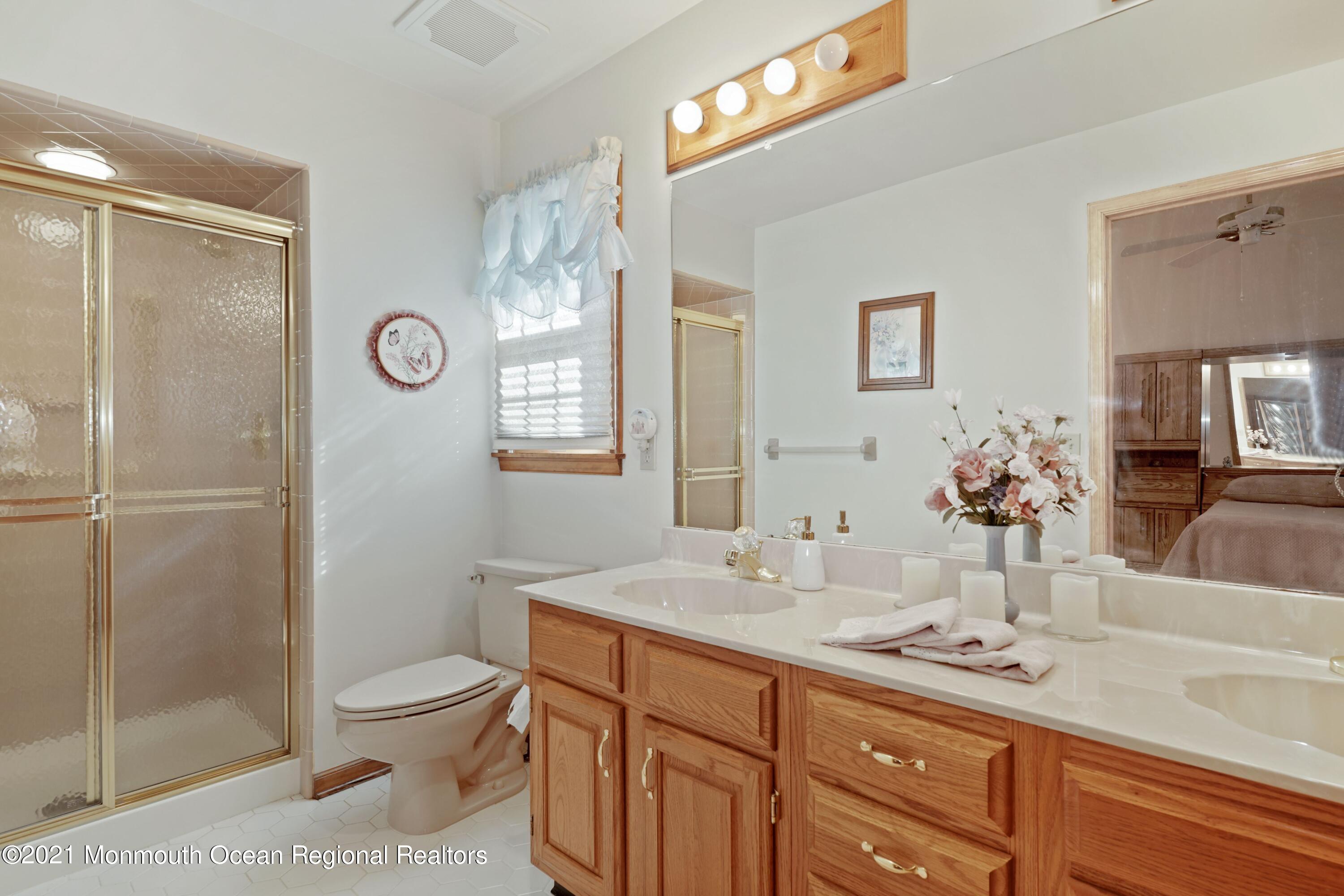 1617 Sweetbay Drive Toms River, NJ 08755 - Photo 10 of 18 a bathroom with a sink a toilet and shower