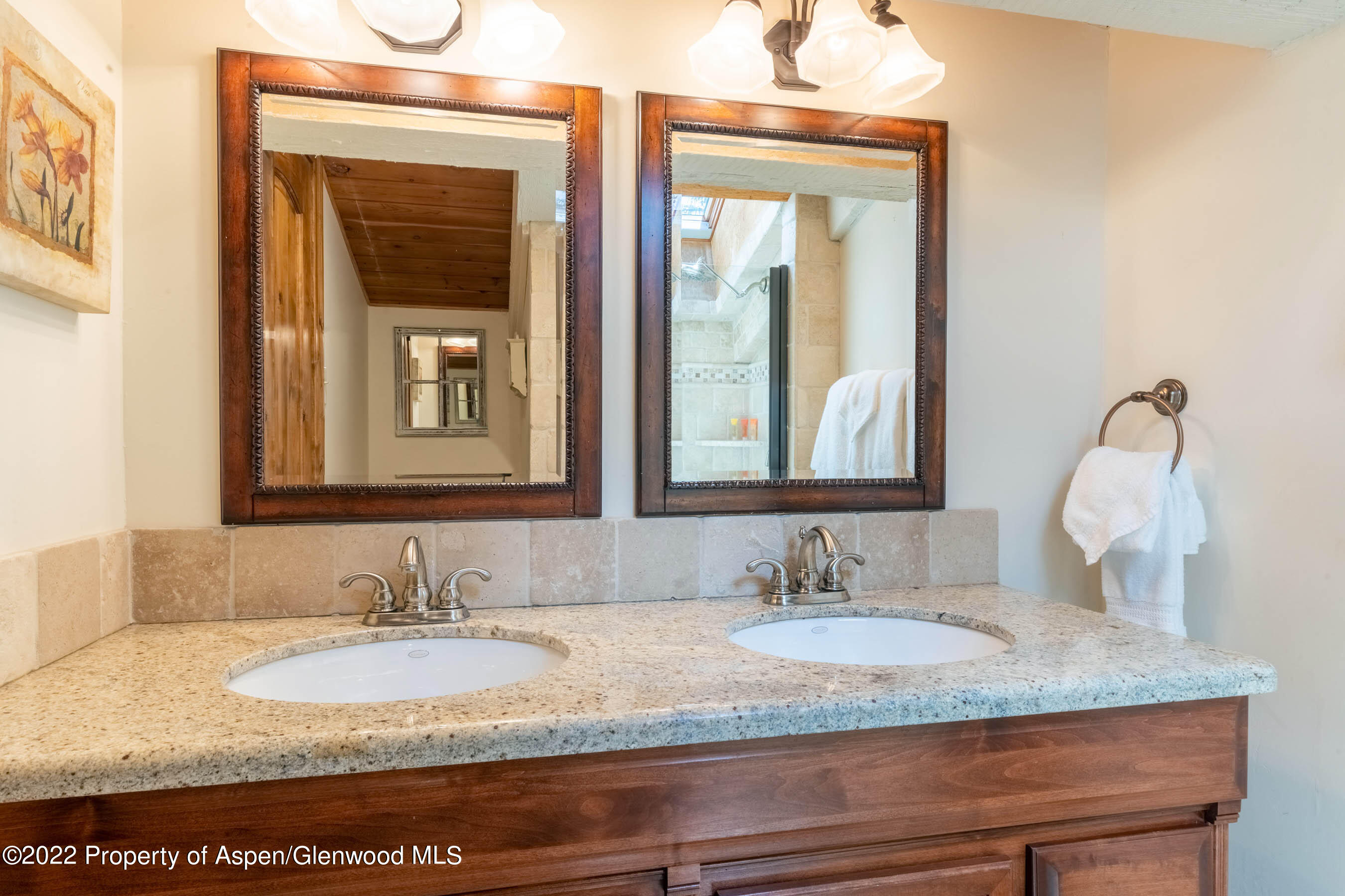 400 Wood Road, Unit 2310 Snowmass Village, CO 81615 - Photo 10 of 18 a bathroom with a granite countertop sink and a mirror