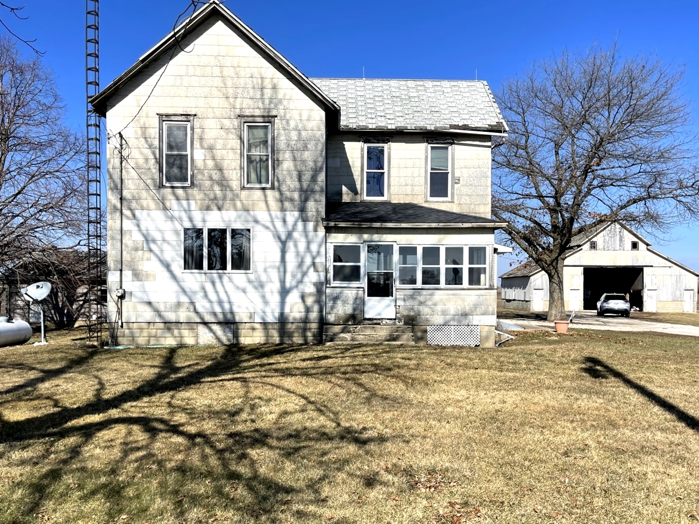 525 North 15th Road Lostant, IL 61334 - Photo 1 of 23 a view of a house with snow on the wall