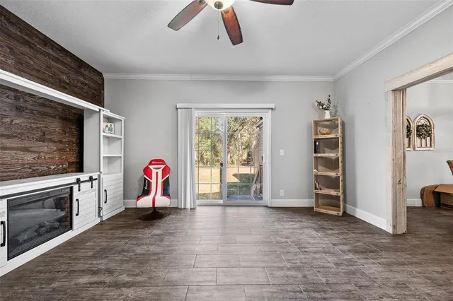 a view of a livingroom with furniture and a fireplace